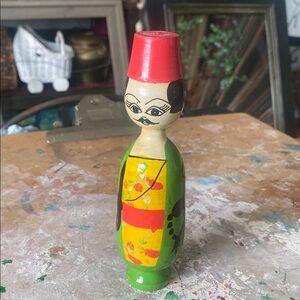 Handcrafted Wooden Doll with Red and Green Accents